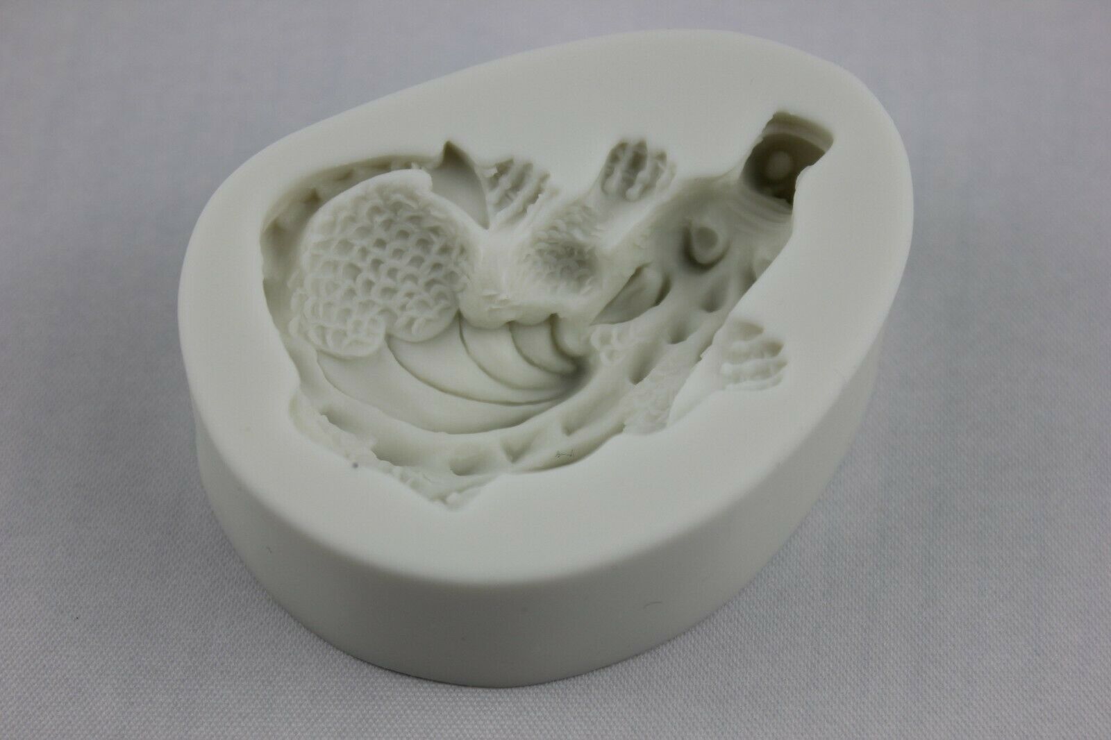 attachment-https://www.cupcakeaddicts.co.uk/wp-content/uploads/imported/2/Crouching-Dragon-Silicone-Mould-Resin-Icing-Fondant-Ice-Soap-Sugar-Craft-Melt-324684428982-4.jpg