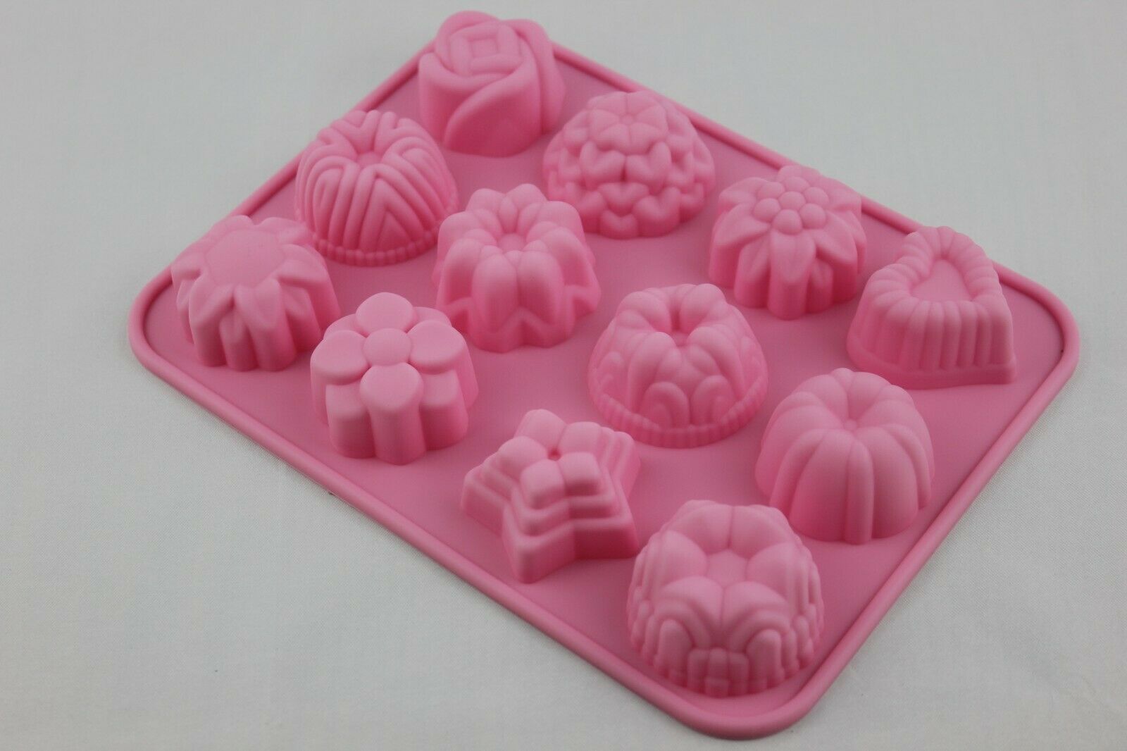 attachment-https://www.cupcakeaddicts.co.uk/wp-content/uploads/imported/8/12-Cell-Silicone-Various-Flowers-Star-Heart-Bunt-mould-Cake-Wax-Candle-Soap-324311985848-5.jpg